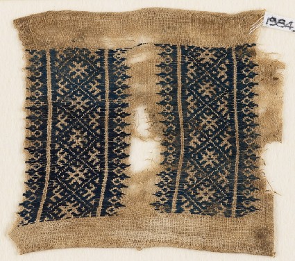 Textile fragment with diamond-shapes and crossesfront