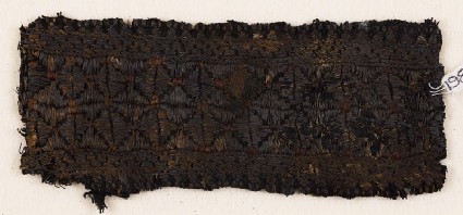 Textile fragment with band of stars or flowersfront