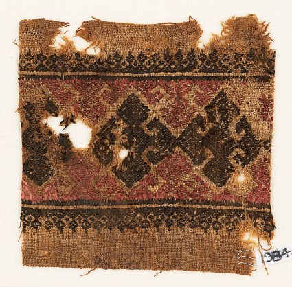 Textile fragment with three diamond-shapes and hooksfront
