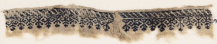 Textile fragment with row of flowersfront