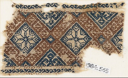 Textile fragment with eight-pointed stars surrounded by crossesfront