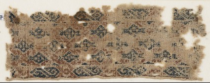 Textile fragment with diamond-shapes set into a diagonal gridfront
