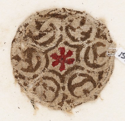 Textile fragment with rosette surrounded by six circlesfront