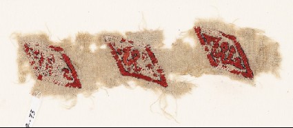 Textile fragment with lozenges and inscriptionfront