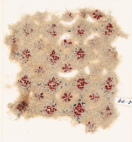 Textile fragment with rosettes, linked circles or hexagons, and inscriptionfront