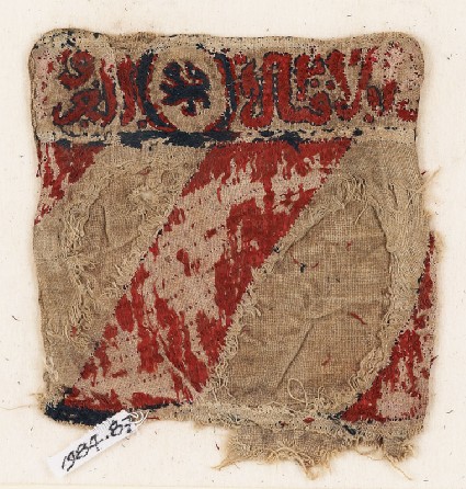 Textile fragment with lion and inscription, possibly from a bag or pocketfront