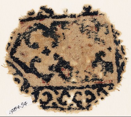 Textile fragment with tab shape, plant, and vinefront