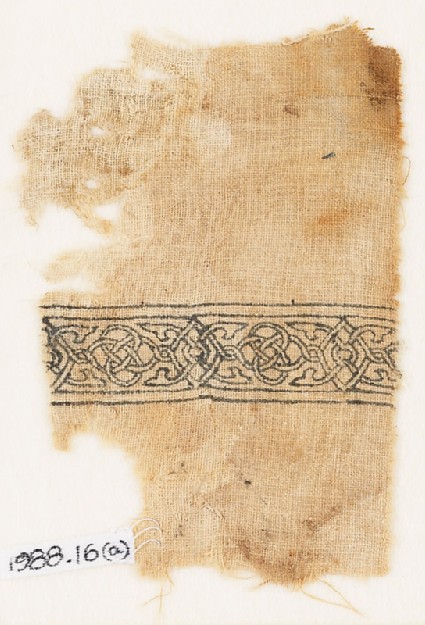 Textile fragment with band of interlacing and four-leaved tendrilsfront