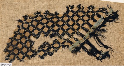 Textile fragment with grid and swastikasfront