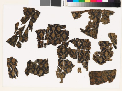 Group of textile fragments with medallions and starsfront