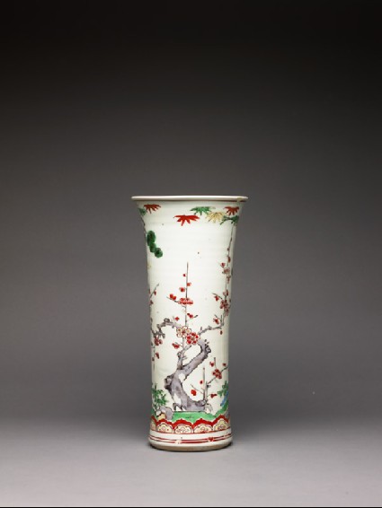 Trumpet vase with pine, prunus, and bambooside