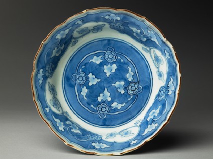 Bowl with foliated rim and floral scrollstop
