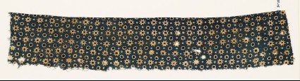 Textile fragment with stars, circles, and dotsfront