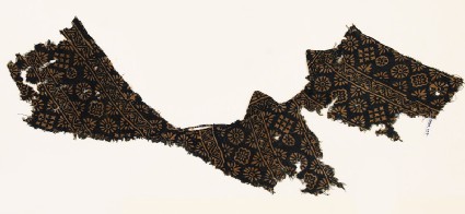 Textile fragment with rosettes, half-rosettes, and crossesfront