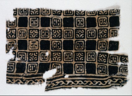 Textile fragment with linked squares, stylized flower-heads, and lines with dotsfront