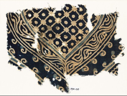 Textile fragment with part of a large medallion with a grid, dots, and a vinefront