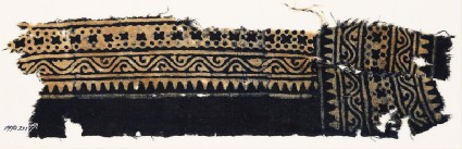 Textile fragment with sawtooth edge, vine, and crossesfront