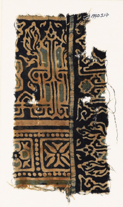 Textile fragment with interlace based on naskhi script, and squares with quatrefoilsfront