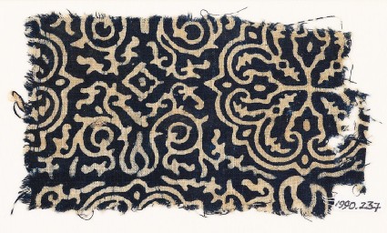 Textile fragment with floral quatrefoil, tendrils, and foliagefront