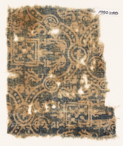 Textile fragment with linked medallions, stylized leaves, and squaresfront