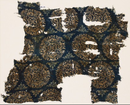 Textile fragment with peacocks and trees in roundelsfront