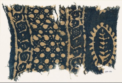 Textile fragment with vines, dots in a grid, and probably a leaffront
