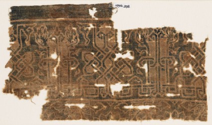 Textile fragment with interlace based on script, leaves, and tendrilsfront