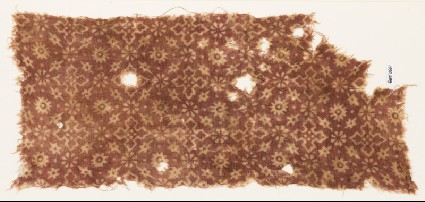 Textile fragment with stars, rosettes, flower-heads, and crossesfront