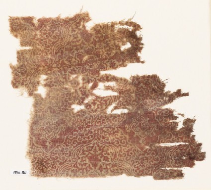 Textile fragment with ornate medallions, leaves, and tendrilsfront