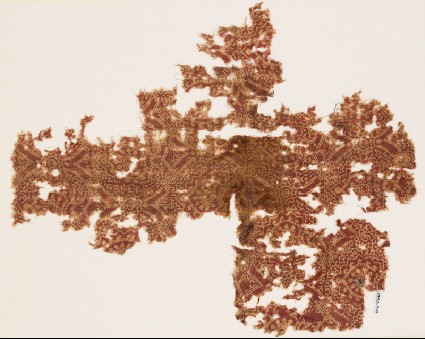 Textile fragment with linked medallions, tendrils, and rosettesfront