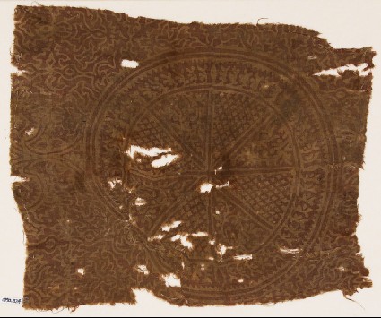 Textile fragment with circle, tendrils, and stylized plantsfront