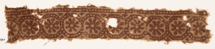 Textile fragment with rosettes in dotted framesfront