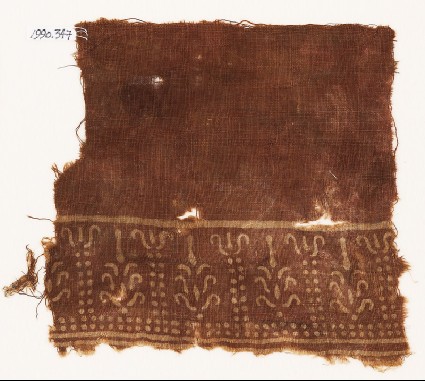 Textile fragment with dots and stylized treesfront