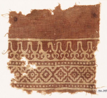 Textile fragment with linked diamond-shapes and stylized leavesfront