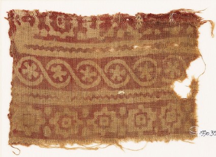 Textile fragment with stepped squares, cable pattern, and flowersfront