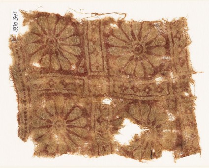Textile fragment with rosettes in a gridfront