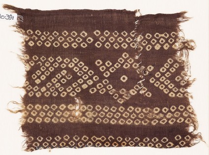 Textile fragment imitating bandhani, or tie-dye, with stars and inverted hooksfront