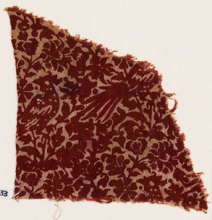 Textile fragment with flowering plants and birdsfront