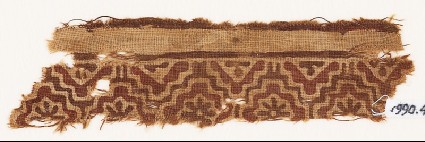 Textile fragment with linked stepped squares and rosettesfront