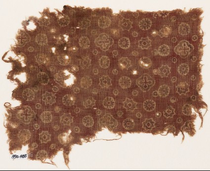 Textile fragment with rosettes, stars, dots, and crossesfront
