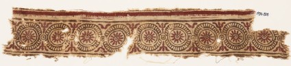 Textile fragment with rosettes in dotted circlesfront