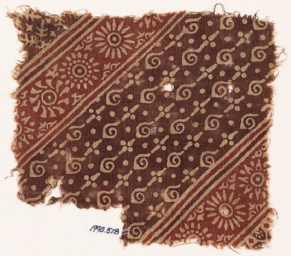 Textile fragment with spirals, dots, and rosettesfront