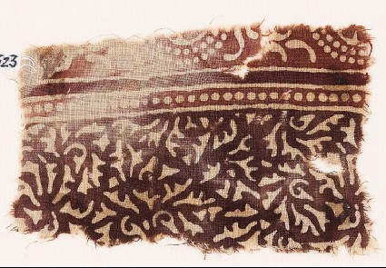 Textile fragment with swirling leaves and tendrilsfront