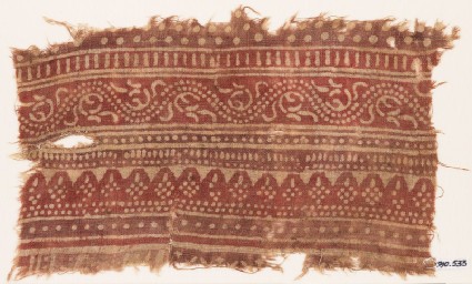 Textile fragment with bands of dotted patterns and vinefront