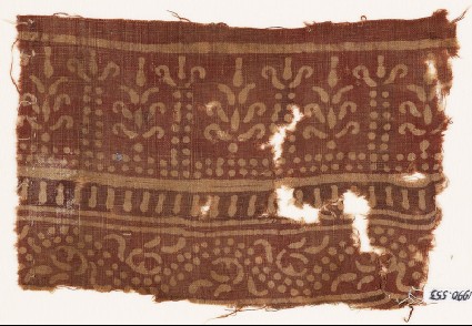 Textile fragment with bands of columns and stylized trees, and a dotted vinefront