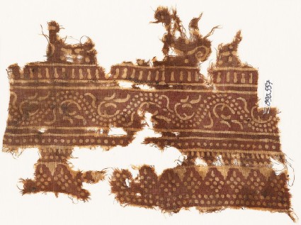 Textile fragment with dotted vine and rhombic shapesfront