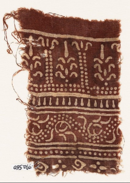Textile fragment with columns, stylized trees, and dotted vinefront