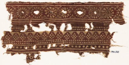 Textile fragment with bands of rosettes and dotted rhombic shapesfront