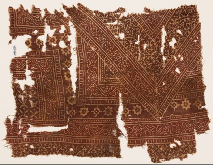 Textile fragment with bands of dotted vines, stars, and serrated crossesfront