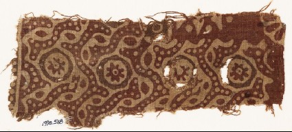 Textile fragment with dotted tendrils and small rosettes in circlesfront